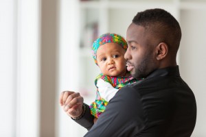 dad holding baby girl